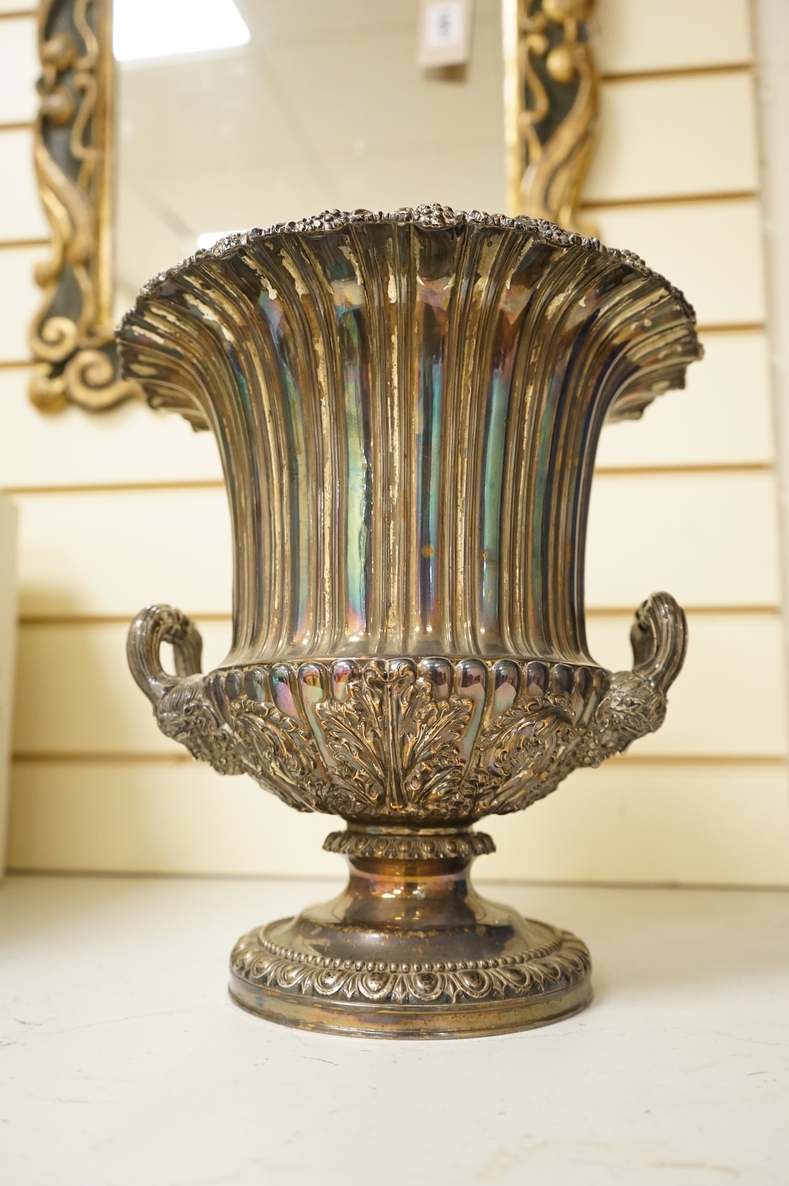 A Victorian silver plated campana wine cooler and removable liner, with vineous cast rim and bacchic mask twin handles, height 26cm.